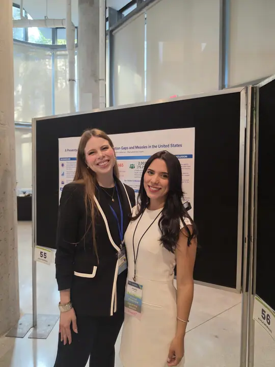Co-authors at their MMR vaccination poster